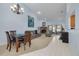 Spacious living room featuring a fireplace and access to the patio at 3985 Mermoor Dr, Palm Harbor, FL 34685
