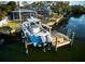 Stunning waterfront home with a private dock and boat lift, perfect for enjoying waterfront living at 3998 South Cir, Largo, FL 33774