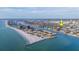 Stunning aerial view of waterfront community with beach access, waterways, and prime location at 421 77Th Ave, St Pete Beach, FL 33706