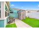 Backyard features an outdoor shower, creating a private retreat for rinsing off after beach days at 421 77Th Ave, St Pete Beach, FL 33706