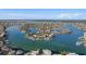 Beautiful aerial view of waterfront homes in Treasure Island, Florida, with stunning water views and lush landscaping at 10128 Paradise Blvd, Treasure Island, FL 33706