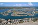 Spectacular aerial view showcasing the community's desirable waterfront location and nearby beach access at 10128 Paradise Blvd, Treasure Island, FL 33706
