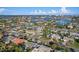 Waterfront community aerial showcases the home's location with coastal views and neighborhood setting at 10128 Paradise Blvd, Treasure Island, FL 33706