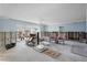 Spacious living room needing renovation after water damage, providing an opportunity to customize at 10128 Paradise Blvd, Treasure Island, FL 33706