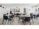 Spacious dining area with multiple tables and chairs, complemented by the open servery at 1055 Philippe Pkwy, Safety Harbor, FL 34695