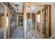 Hallway with exposed walls showing the frame and space for electrical wiring at 15804 Redington Dr, Redington Beach, FL 33708