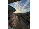 Scenic balcony view overlooking parking, palm trees and waterway on a beautiful day at 18400 Gulf Blvd # 1505, Indian Shores, FL 33785
