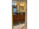 Bathroom with dual sinks and granite countertops at 18400 Gulf Blvd # 1505, Indian Shores, FL 33785