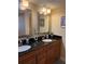 Bathroom with dual sinks and granite countertops at 18400 Gulf Blvd # 1505, Indian Shores, FL 33785