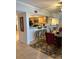 View of dining and kitchen area featuring bar seating, updated kitchen appliances, and tile flooring at 18400 Gulf Blvd # 1505, Indian Shores, FL 33785
