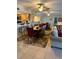 Open dining area with seating for six and kitchen barstools, all situated on decorative tile flooring at 18400 Gulf Blvd # 1505, Indian Shores, FL 33785