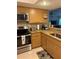 Well-equipped kitchen featuring modern appliances and convenient access to the living area at 18400 Gulf Blvd # 1505, Indian Shores, FL 33785