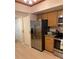 Modern kitchen design with stainless steel refrigerator, light-colored cabinets, and lots of storage at 18400 Gulf Blvd # 1505, Indian Shores, FL 33785