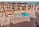 Beautiful view of the outdoor pool and sun deck area with chairs and lounge seating at 18400 Gulf Blvd # 1505, Indian Shores, FL 33785