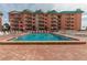 Beautiful outdoor pool surrounded by lounge chairs at 18400 Gulf Blvd # 1505, Indian Shores, FL 33785