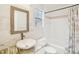 Bathroom featuring marble countertop, vessel sink, and bathtub at 2794 Countryside Blvd # 1, Clearwater, FL 33761