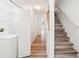Hallway with wood-look floors and staircase at 2794 Countryside Blvd # 1, Clearwater, FL 33761
