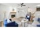 Inviting living room with fireplace, hardwood floors, open floorplan, modern furniture, and ample natural light at 2794 Countryside Blvd # 1, Clearwater, FL 33761