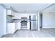 Updated kitchen featuring stainless steel appliances, white cabinetry, and modern countertops at 5836 8Th St, Zephyrhills, FL 33542