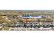 Scenic aerial view of townhouses with a lake in the background and assigned parking at 6333 Osprey Lake Cir, Riverview, FL 33578