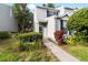 Charming two-story home with blue shutters and a landscaped front yard provides great curb appeal at 6333 Osprey Lake Cir, Riverview, FL 33578