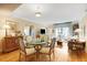 Inviting dining area with a glass-top table, comfortable chairs, and stylish decor, open to the living room at 275 Bayshore Blvd # 408, Tampa, FL 33606