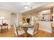 Charming dining area with a glass table, seating for four, and a view towards the hallway and kitchen at 275 Bayshore Blvd # 408, Tampa, FL 33606