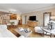 Open concept living space with hardwood floors, comfortable seating, and seamless transition to dining and kitchen at 275 Bayshore Blvd # 408, Tampa, FL 33606