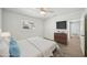 Cozy bedroom featuring ample closet space and a dresser with flatscreen TV at 4318 1St S Ave, St Petersburg, FL 33711
