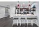 Bright kitchen with bar seating, pendant lighting, and stainless steel appliances at 1203 Desmond St, Port Charlotte, FL 33952