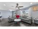 Bright living room with a comfortable gray sectional sofa, accent pillows, and a decorative marble-topped table at 1203 Desmond St, Port Charlotte, FL 33952