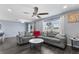 Bright living room with gray seating, a marble coffee table, and large windows at 1203 Desmond St, Port Charlotte, FL 33952