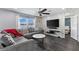 Cozy living room with gray sectional, marble coffee table, and shiplap accent wall at 1203 Desmond St, Port Charlotte, FL 33952