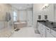 Main bathroom features a spacious shower, tub and double vanities at 14215 Swiss Bridge Dr, Riverview, FL 33579