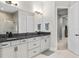 Bathroom with granite countertops, double sinks, modern lighting, and a walk-in shower at 14215 Swiss Bridge Dr, Riverview, FL 33579