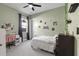 Bedroom featuring light green walls, white trim, ceiling fan, window, and gray carpet at 14215 Swiss Bridge Dr, Riverview, FL 33579