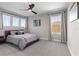 Bright bedroom with three large windows and a cozy, neutral color scheme at 14215 Swiss Bridge Dr, Riverview, FL 33579