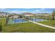 Two pickleball courts in a fenced area with a walking path and surrounding houses at 14215 Swiss Bridge Dr, Riverview, FL 33579