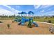 Playground with climbing structures, slides, and swings in a grassy field at 14215 Swiss Bridge Dr, Riverview, FL 33579