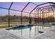 The private pool, featuring a built-in spa and cascading waterfall, offers a refreshing retreat at 14215 Swiss Bridge Dr, Riverview, FL 33579