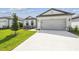Charming single-Gathering home featuring a two-car garage, well-maintained lawn, and welcoming curb appeal at 4306 Big Sky Dr, Spring Hill, FL 34604