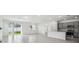 Open-concept living space features a sliding glass door to the backyard and view of kitchen at 4306 Big Sky Dr, Spring Hill, FL 34604