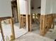 Open-concept living space with exposed framing, tile flooring, and potential for a modern design at 4826 W San Jose St, Tampa, FL 33629