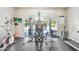 Well-equipped fitness center featuring modern exercise machines and a view of the community pool at 4984 Anniston Cir, Tampa, FL 33647