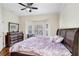 Bedroom featuring a large bay window, dark wood furniture, and ample natural light at 4984 Anniston Cir, Tampa, FL 33647