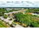 Aerial view of the condo community featuring lush landscaping and tranquil lakes at 5849 Park N St # 201, St Petersburg, FL 33709