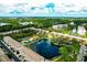 Aerial view of a condo community featuring lakes, lush greenery, and easy access to highways at 5849 Park N St # 201, St Petersburg, FL 33709