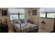 Cozy bedroom with natural light, complemented by comfortable decor, and stylish metal bed frame at 5849 Park N St # 201, St Petersburg, FL 33709