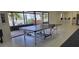 Game room featuring a ping pong table and large windows overlooking a tranquil lake at 5849 Park N St # 201, St Petersburg, FL 33709