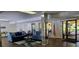 Comfortable lobby featuring cozy seating, a vibrant rug, and ample natural light at 5849 Park N St # 201, St Petersburg, FL 33709